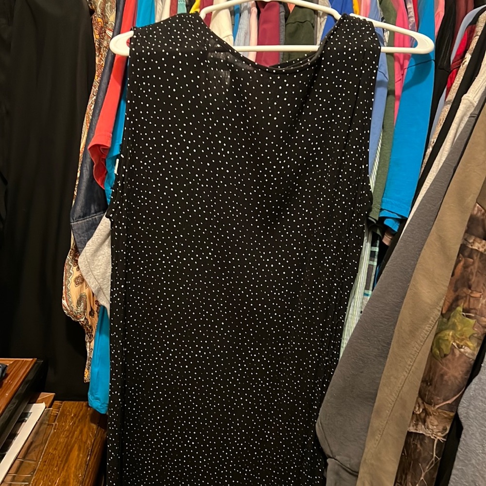 Long sleeveless black polka dot dress